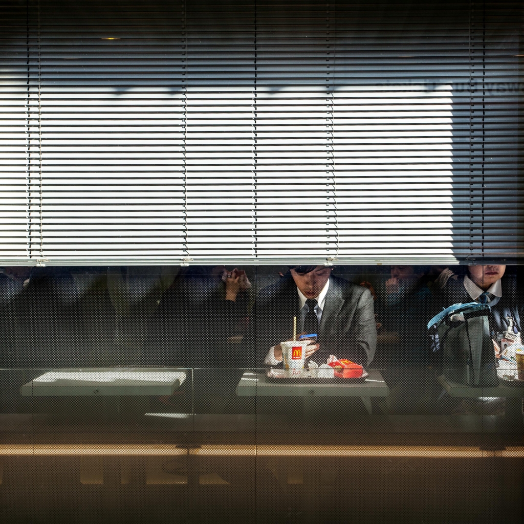 Photo by Turi Calafato A fast-food restaurant in Japan. In some modern cultures, the activity of eating is often a solitary experience: in single seats at solo tables.