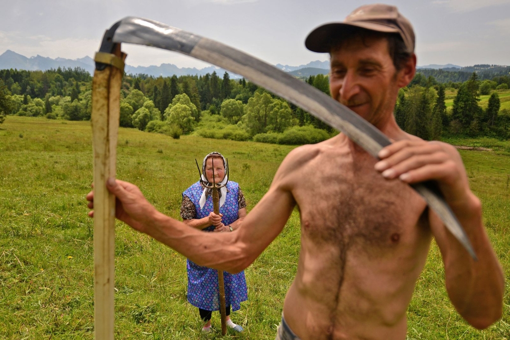 Photo and caption by Bartłomiej Jurecki Traditional haymaking in Poland. Many people continue to use the scythe and pitchfork to sort the hay.