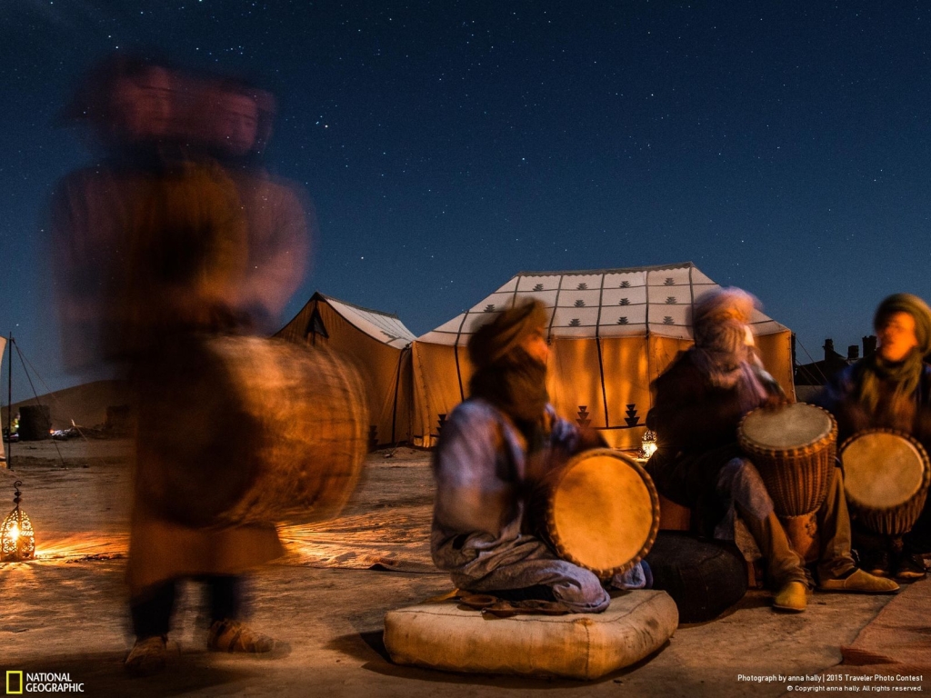 Photo and caption by Anna Hally New Year's eve celebrations in Erg Chigaga, Sahara desert - the night sky was spectacular but freezing cold. So we surrounded the campfire in order to stay warm and enjoy the local Berber music.