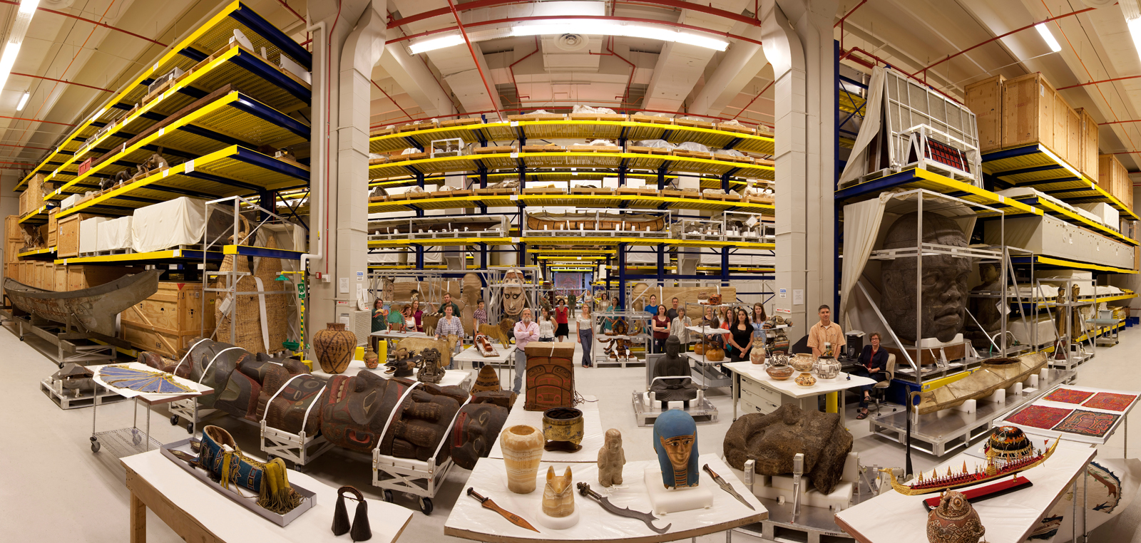 Anthropological collections on display in Pod 4 (designed to house oversized objects) at the Smithsonian Institution's Museum Support Center (MSC), located in Suitland, Maryland. Anthropology collections staff present. Panoramic image #7 of 7 at 26mm focal length.